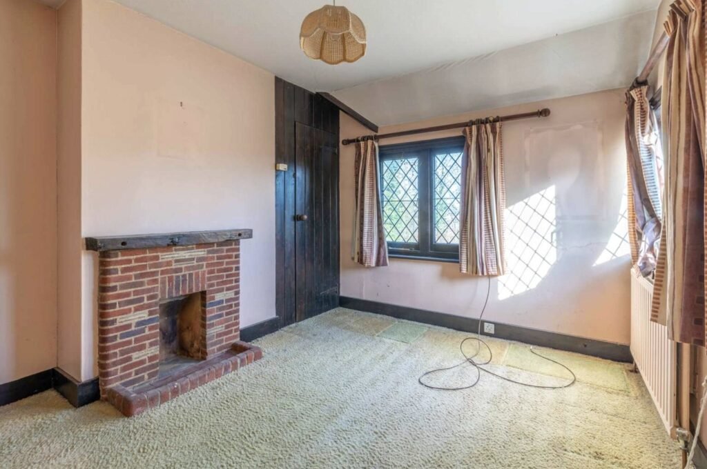 Pink Floyd guitarist David Gilmour former Essex home set in 4.66 acres with a lake and studio outbuilding is for sale at £1.1m offering buyers rock history.