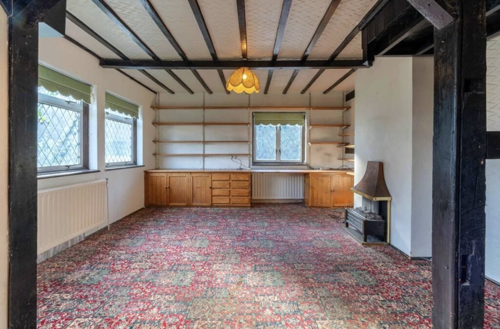 Pink Floyd guitarist David Gilmour former Essex home set in 4.66 acres with a lake and studio outbuilding is for sale at £1.1m offering buyers rock history.