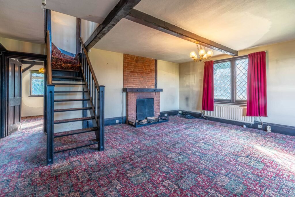 Pink Floyd guitarist David Gilmour former Essex home set in 4.66 acres with a lake and studio outbuilding is for sale at £1.1m offering buyers rock history.