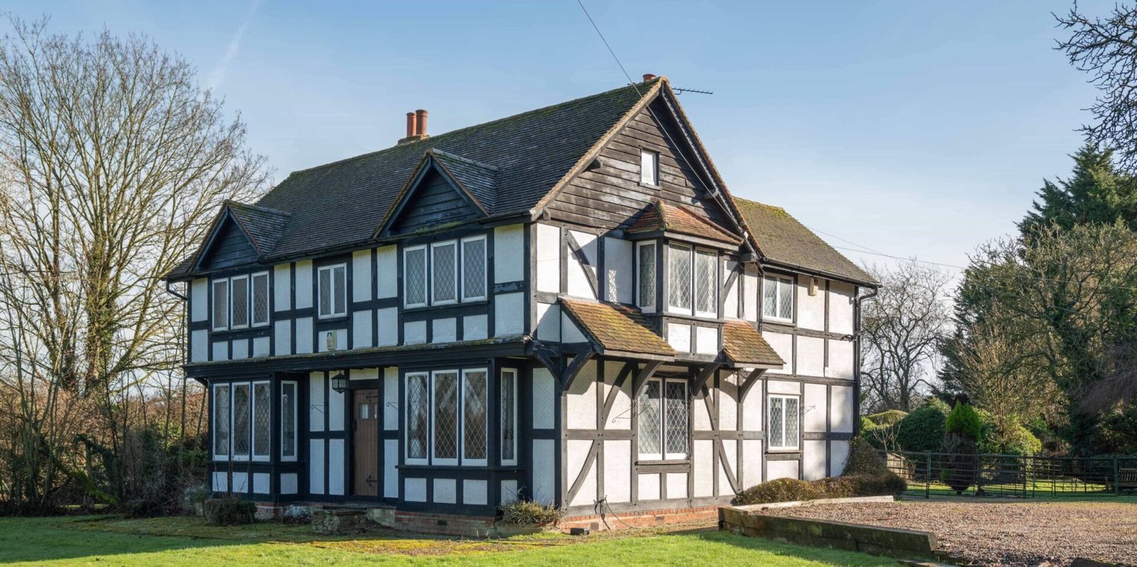 Pink Floyd guitarist David Gilmour former Essex home set in 4.66 acres with a lake and studio outbuilding is for sale at £1.1m offering buyers rock history.