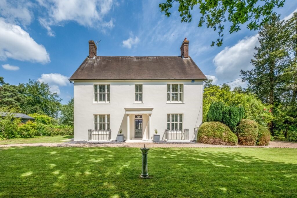 A Georgian country home once owned by James Bond’s gadget master Q hits the market, blending historic charm with modern upgrades and strong eco credentials in a sought-after setting