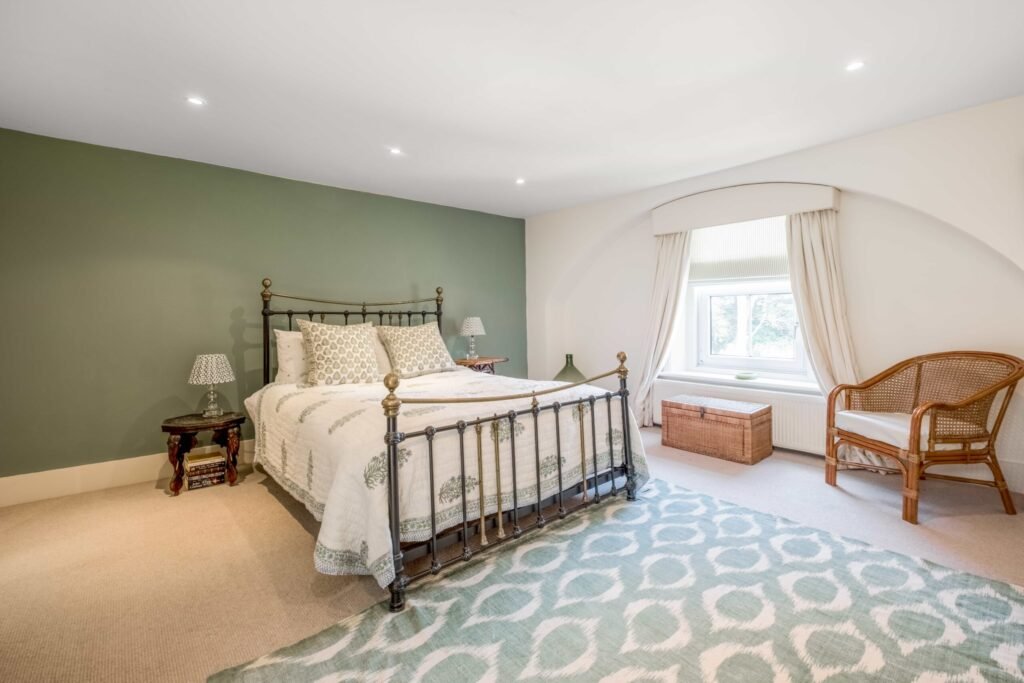 A Georgian country home once owned by James Bond’s gadget master Q hits the market, blending historic charm with modern upgrades and strong eco credentials in a sought-after setting