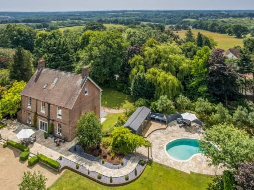 A Georgian country home once owned by James Bond’s gadget master Q hits the market, blending historic charm with modern upgrades and strong eco credentials in a sought-after setting