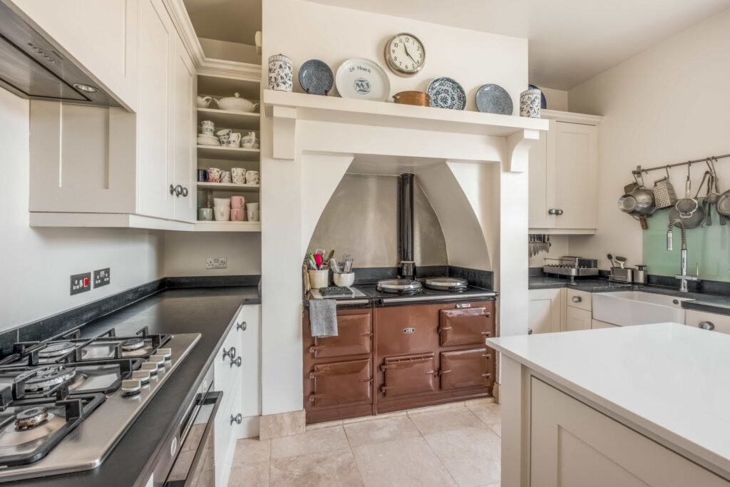 A Georgian country home once owned by James Bond’s gadget master Q hits the market, blending historic charm with modern upgrades and strong eco credentials in a sought-after setting