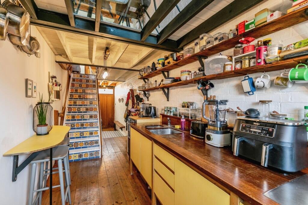 A quirky Bristol home barely wider than a tube carriage has hit the market for £325,000, packing clever design, a raised sleeping platform and cosy features into just 7ft 5in.