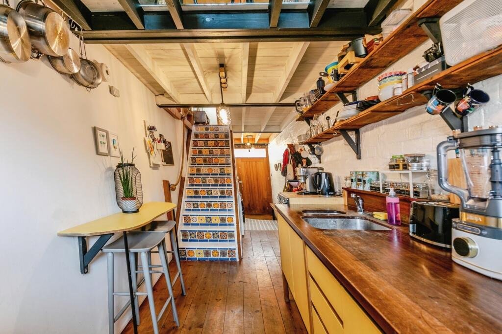 A quirky Bristol home barely wider than a tube carriage has hit the market for £325,000, packing clever design, a raised sleeping platform and cosy features into just 7ft 5in.