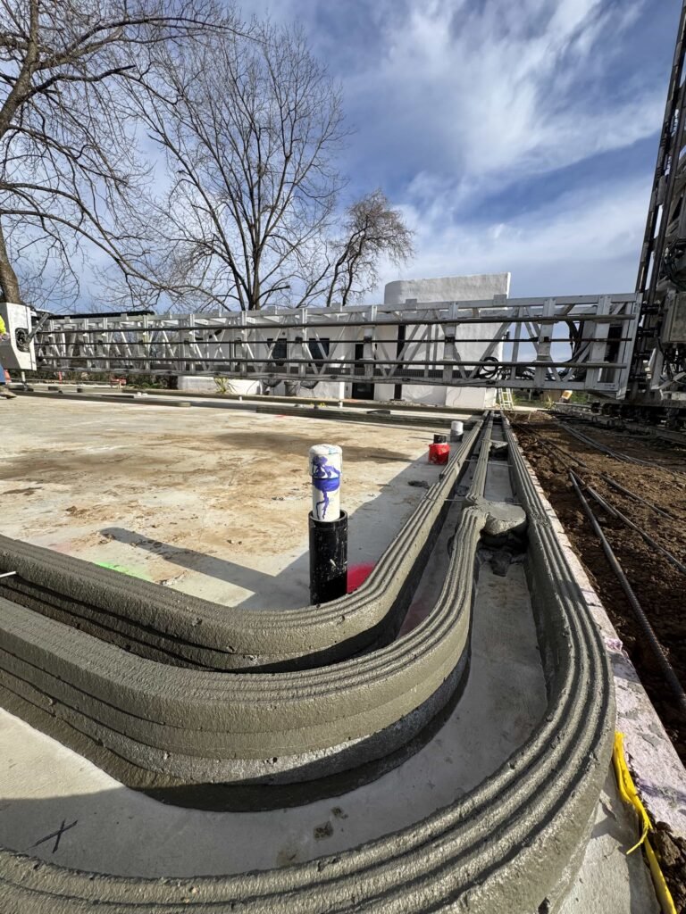 A 3D printer has created the first affordable neighbourhood in California, with bulletproof concrete homes from 4DIFY hitting the market at £280,000.