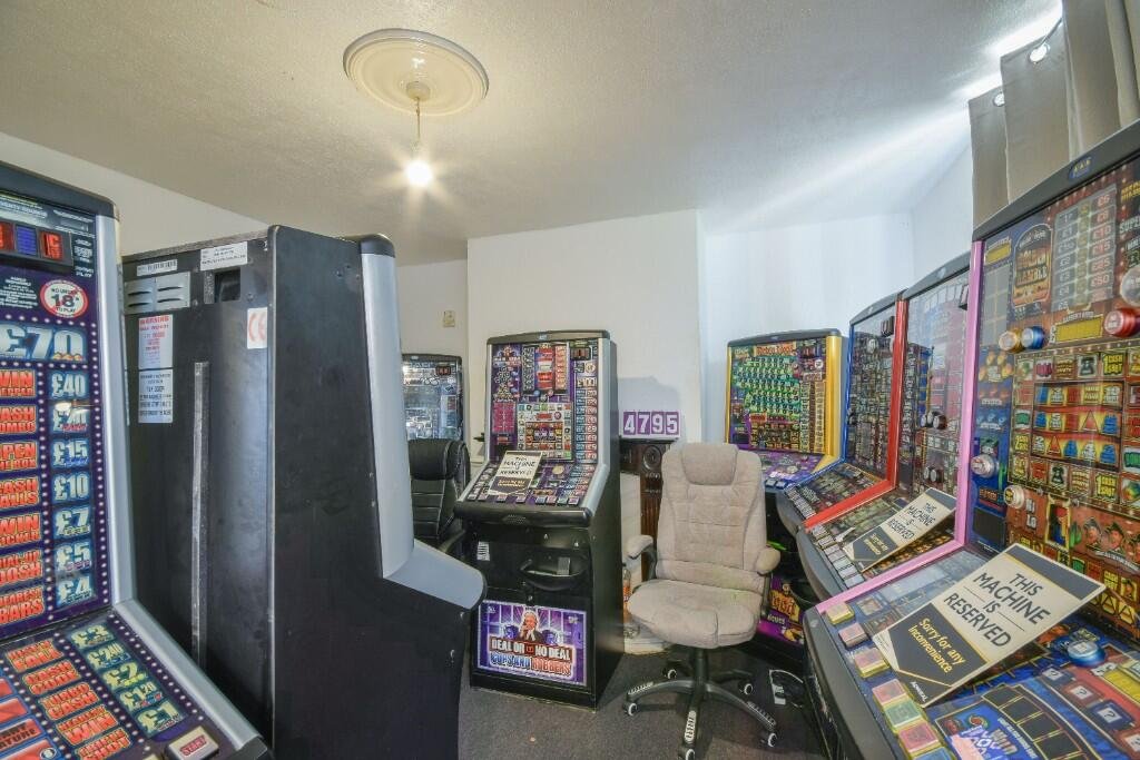 A quirky home packed with 13 slot machines has gone on sale for £92,000, offering rental income and a unique arcade-style room but struggling to attract buyers