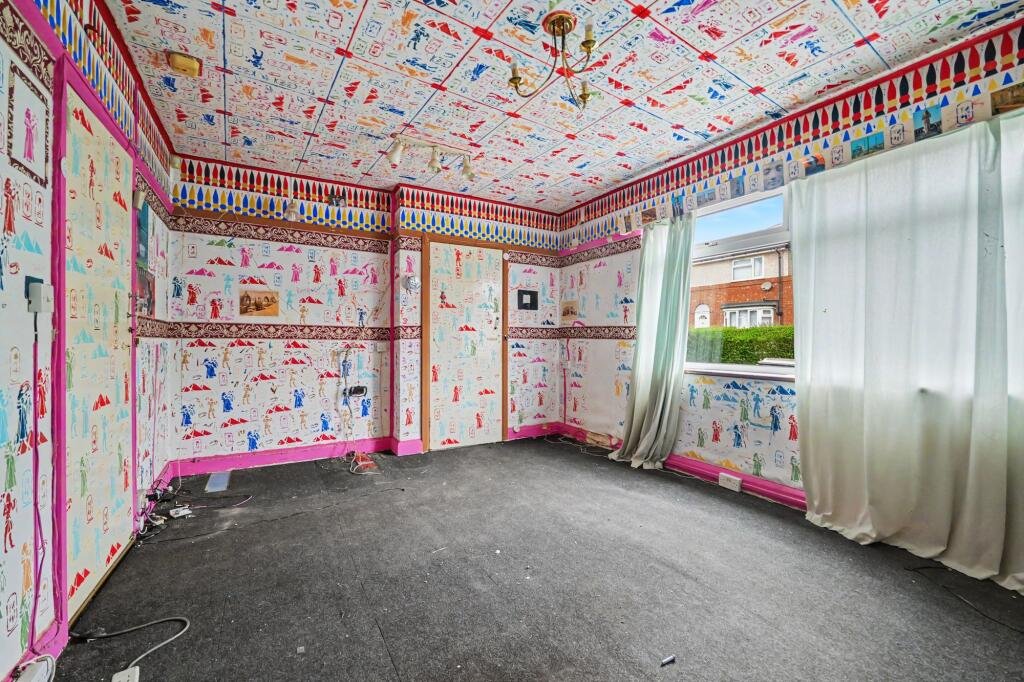 A £125,000 Nuneaton terrace with Egyptian murals, religious icons, and Jedward posters has left buyers baffled, but agents say it offers strong renovation potential.