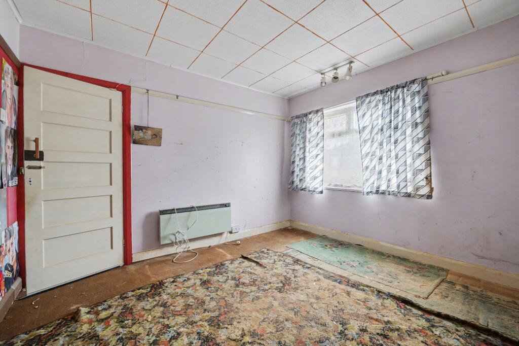 A £125,000 Nuneaton terrace with Egyptian murals, religious icons, and Jedward posters has left buyers baffled, but agents say it offers strong renovation potential.