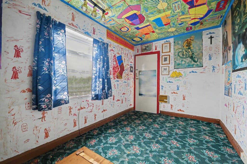 A £125,000 Nuneaton terrace with Egyptian murals, religious icons, and Jedward posters has left buyers baffled, but agents say it offers strong renovation potential.