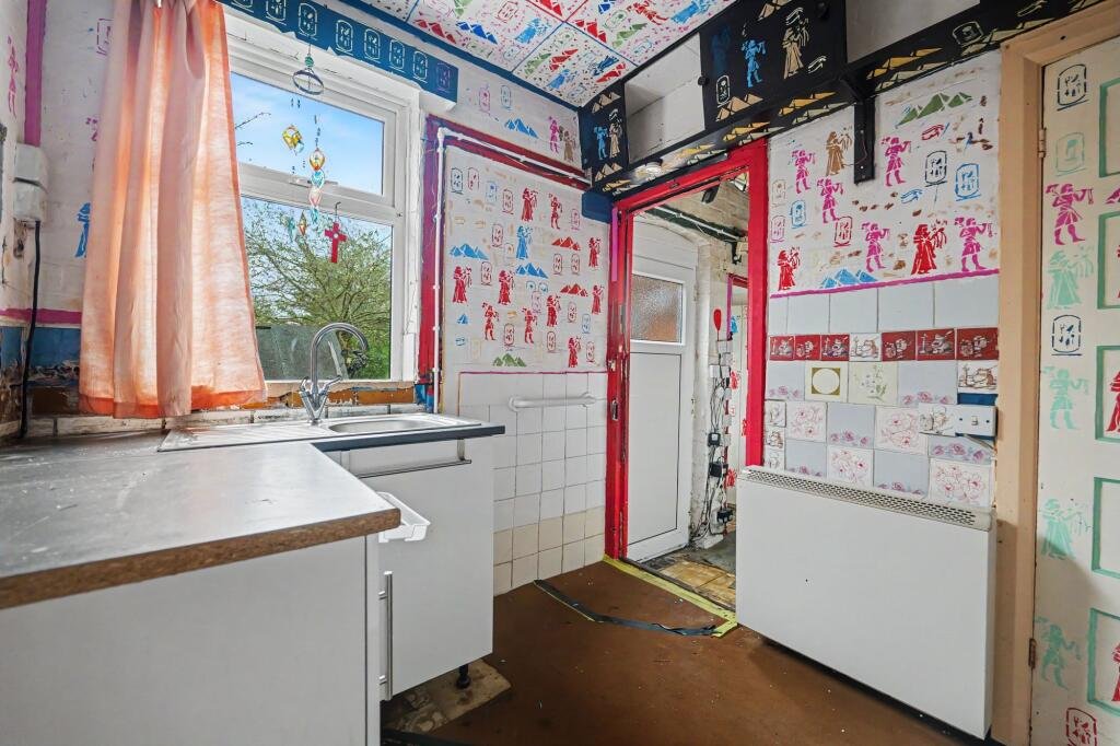 A £125,000 Nuneaton terrace with Egyptian murals, religious icons, and Jedward posters has left buyers baffled, but agents say it offers strong renovation potential.
