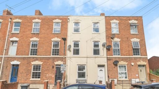 An eight-bedroom home next door to Fred West's infamous Gloucester murder house is on the market, with agents warning buyers of the street's dark and notorious history.