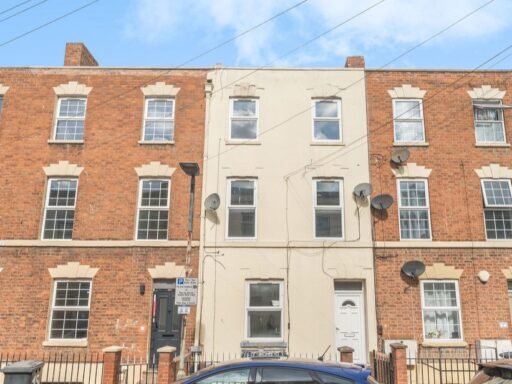 An eight-bedroom home next door to Fred West's infamous Gloucester murder house is on the market, with agents warning buyers of the street's dark and notorious history.