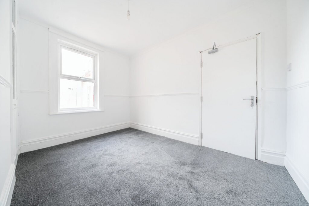 An eight-bedroom home next door to Fred West's infamous Gloucester murder house is on the market, with agents warning buyers of the street's dark and notorious history.