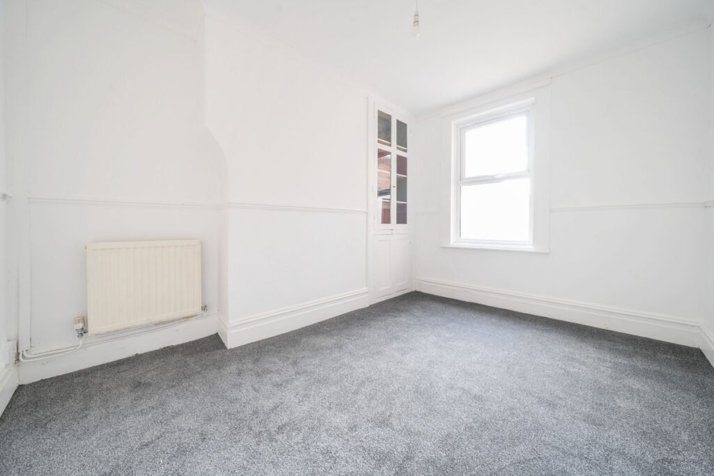 An eight-bedroom home next door to Fred West's infamous Gloucester murder house is on the market, with agents warning buyers of the street's dark and notorious history.