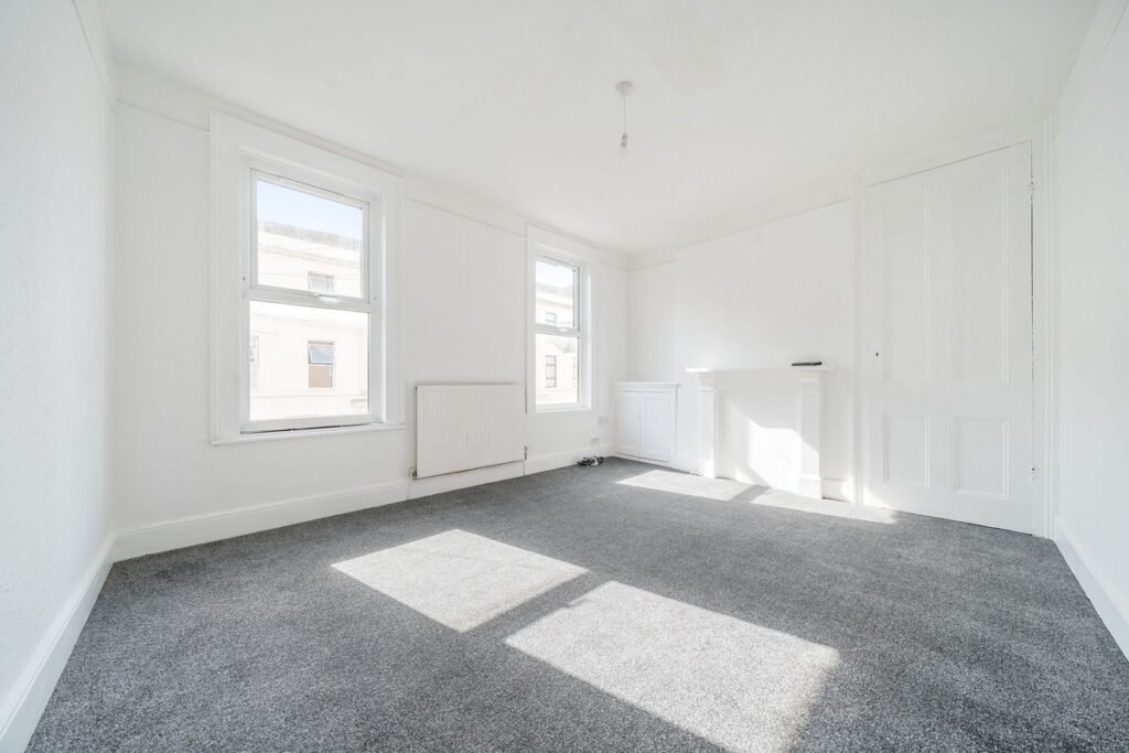 An eight-bedroom home next door to Fred West's infamous Gloucester murder house is on the market, with agents warning buyers of the street's dark and notorious history.