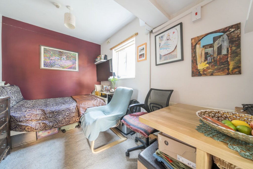 An eight-bedroom home next door to Fred West's infamous Gloucester murder house is on the market, with agents warning buyers of the street's dark and notorious history.