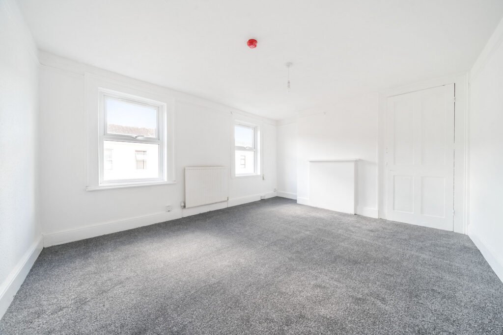 An eight-bedroom home next door to Fred West's infamous Gloucester murder house is on the market, with agents warning buyers of the street's dark and notorious history.