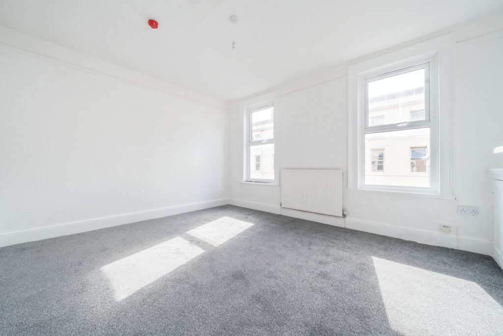 An eight-bedroom home next door to Fred West's infamous Gloucester murder house is on the market, with agents warning buyers of the street's dark and notorious history.