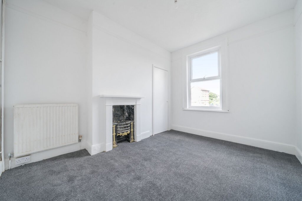 An eight-bedroom home next door to Fred West's infamous Gloucester murder house is on the market, with agents warning buyers of the street's dark and notorious history.