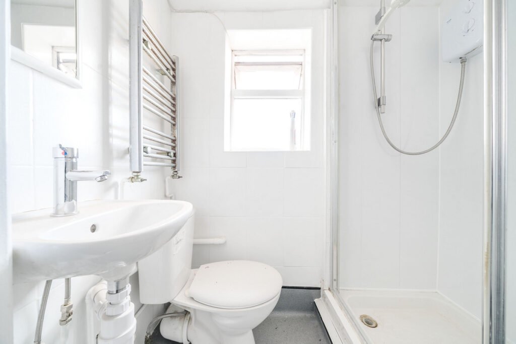 An eight-bedroom home next door to Fred West's infamous Gloucester murder house is on the market, with agents warning buyers of the street's dark and notorious history.