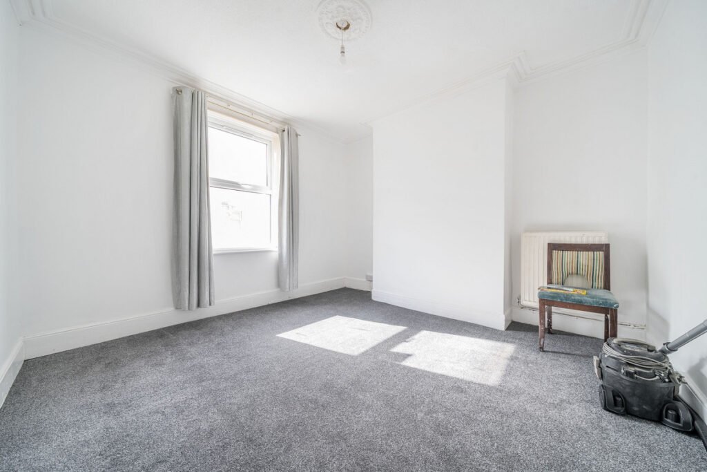 An eight-bedroom home next door to Fred West's infamous Gloucester murder house is on the market, with agents warning buyers of the street's dark and notorious history.