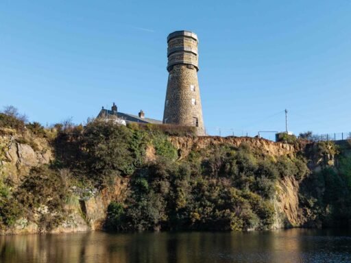A historic 69ft windmill in Guernsey, once a WWII lookout, is for sale with plans to convert it into a striking four-bedroom home with observation deck and quarry views.