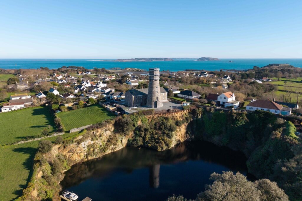 A historic 69ft windmill in Guernsey, once a WWII lookout, is for sale with plans to convert it into a striking four-bedroom home with observation deck and quarry views.