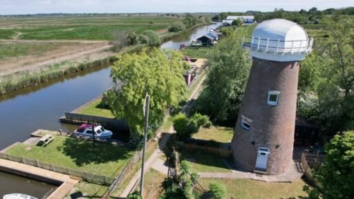 A historic converted windmill in the Norfolk Broads has hit the market for £495,000, offering river views, original features and a rare private mooring in a tranquil setting.