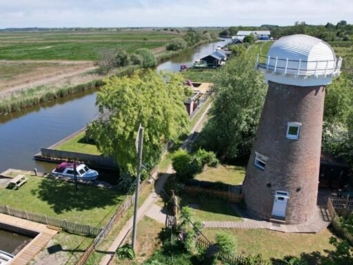A historic converted windmill in the Norfolk Broads has hit the market for £495,000, offering river views, original features and a rare private mooring in a tranquil setting.