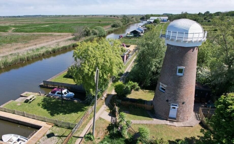 A historic converted windmill in the Norfolk Broads has hit the market for £495,000, offering river views, original features and a rare private mooring in a tranquil setting.