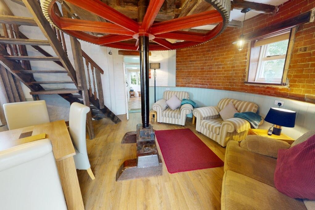 A historic converted windmill in the Norfolk Broads has hit the market for £495,000, offering river views, original features and a rare private mooring in a tranquil setting.