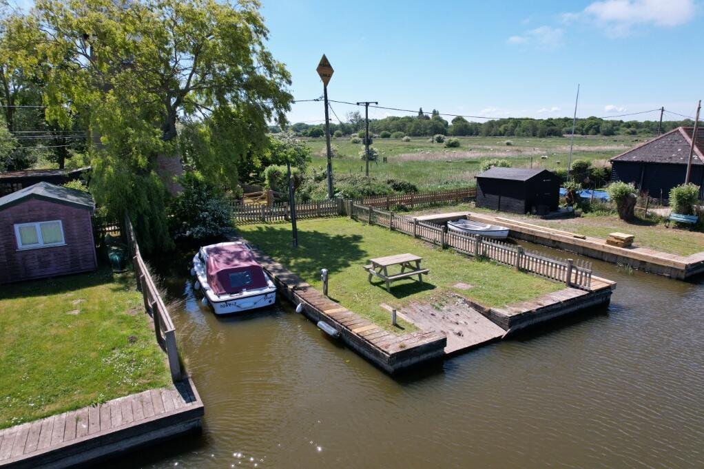 A historic converted windmill in the Norfolk Broads has hit the market for £495,000, offering river views, original features and a rare private mooring in a tranquil setting.