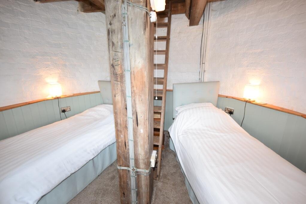 A historic converted windmill in the Norfolk Broads has hit the market for £495,000, offering river views, original features and a rare private mooring in a tranquil setting.