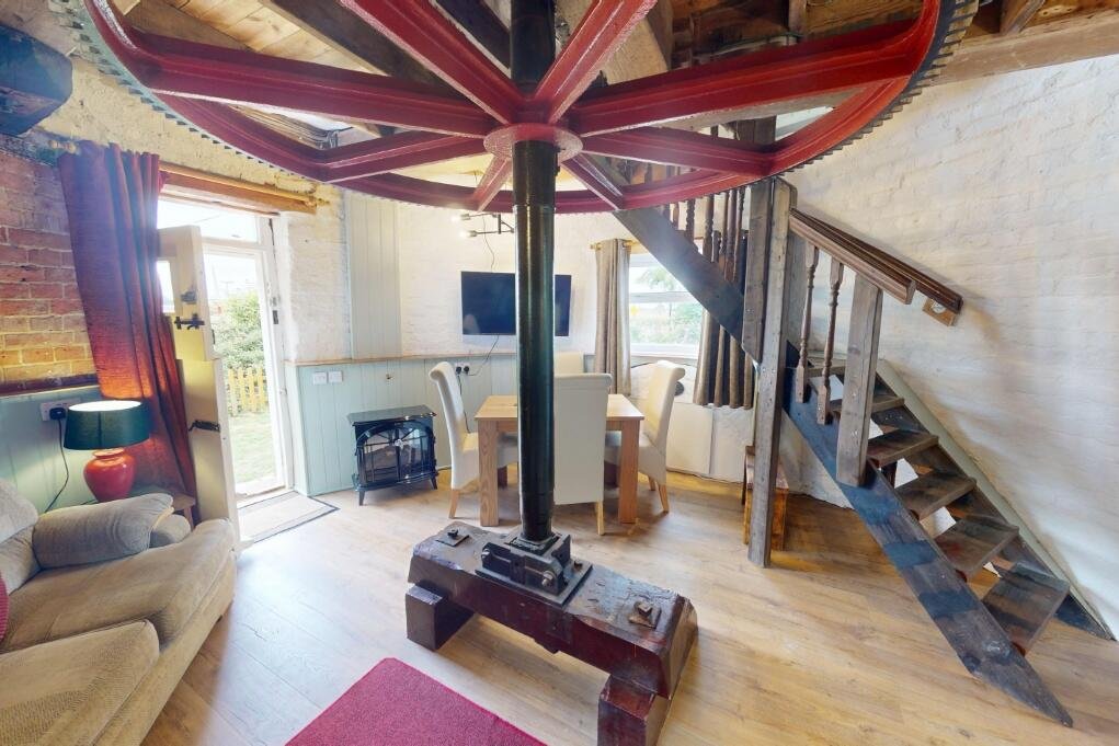 A historic converted windmill in the Norfolk Broads has hit the market for £495,000, offering river views, original features and a rare private mooring in a tranquil setting.