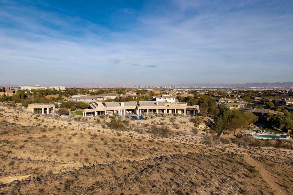 A luxury Las Vegas estate owned by the Morton family hits the market for £14.7m, boasting resort-style living, a waterslide and space for 250 guests in a stunning desert setting.