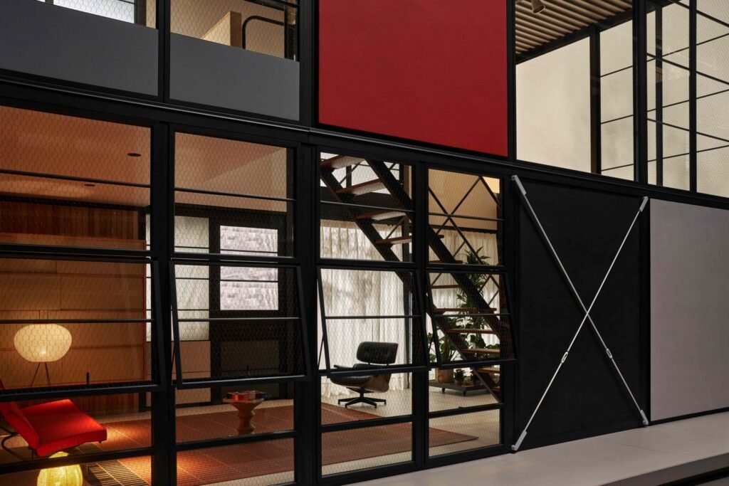 The iconic Eames House is reimagined as a flatpack modular home system, letting buyers build and customise their own stylish version with modern, sustainable design.