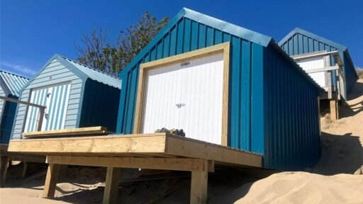 A small beach hut without mains power on sale for £200,000 at Abersoch beach, Gwynedd, Wales - same price as nearby houses with stunning Cardigan Bay views.