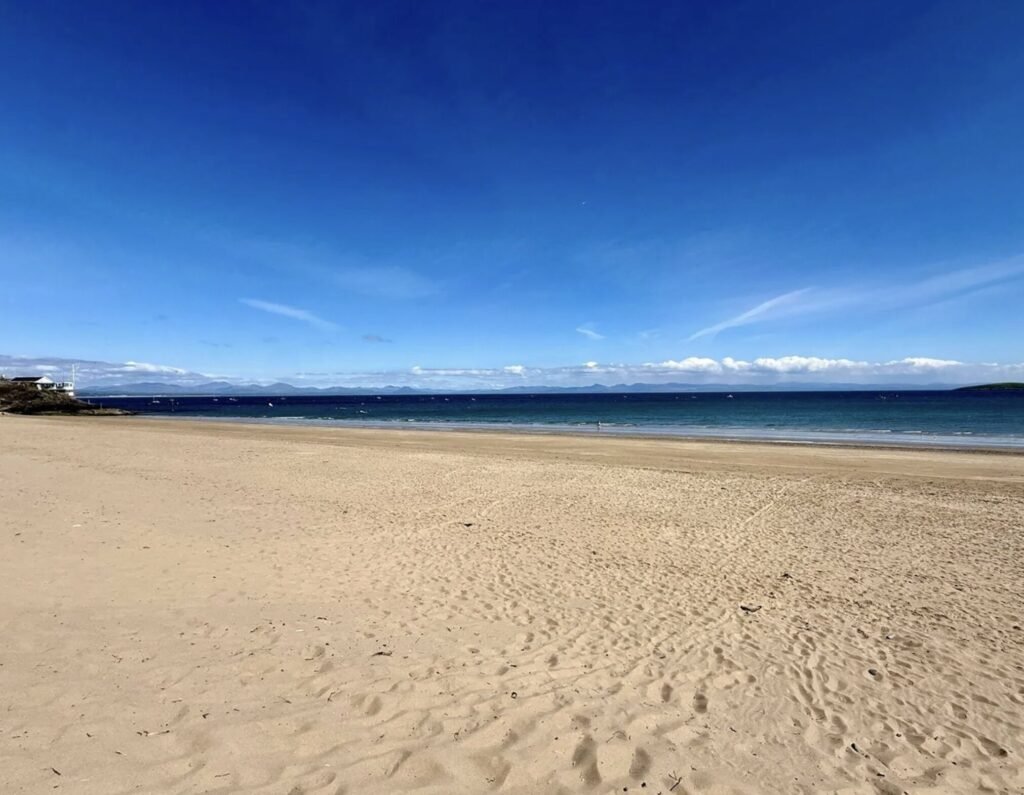 A small beach hut without mains power on sale for £200,000 at Abersoch beach, Gwynedd, Wales - same price as nearby houses with stunning Cardigan Bay views.