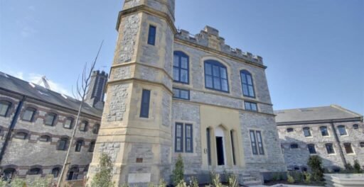 A luxury flat inside one of Britain's most notorious former prisons is on the market for £180,000 - the Victorian jail once housed serial killer Archibald Hall and EastEnders star Leslie Grantham.