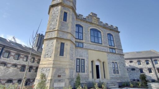 A luxury flat inside one of Britain's most notorious former prisons is on the market for £180,000 - the Victorian jail once housed serial killer Archibald Hall and EastEnders star Leslie Grantham.
