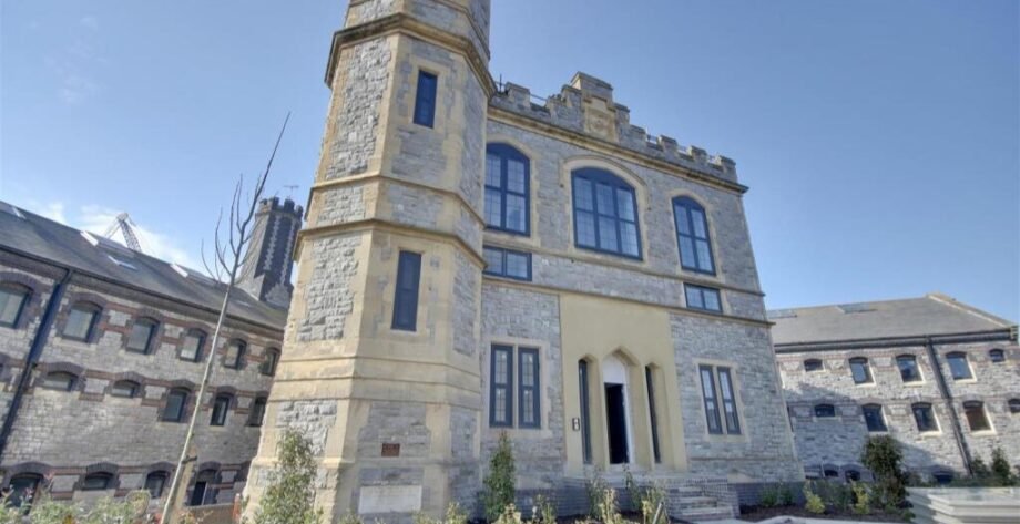 A luxury flat inside one of Britain's most notorious former prisons is on the market for £180,000 - the Victorian jail once housed serial killer Archibald Hall and EastEnders star Leslie Grantham.