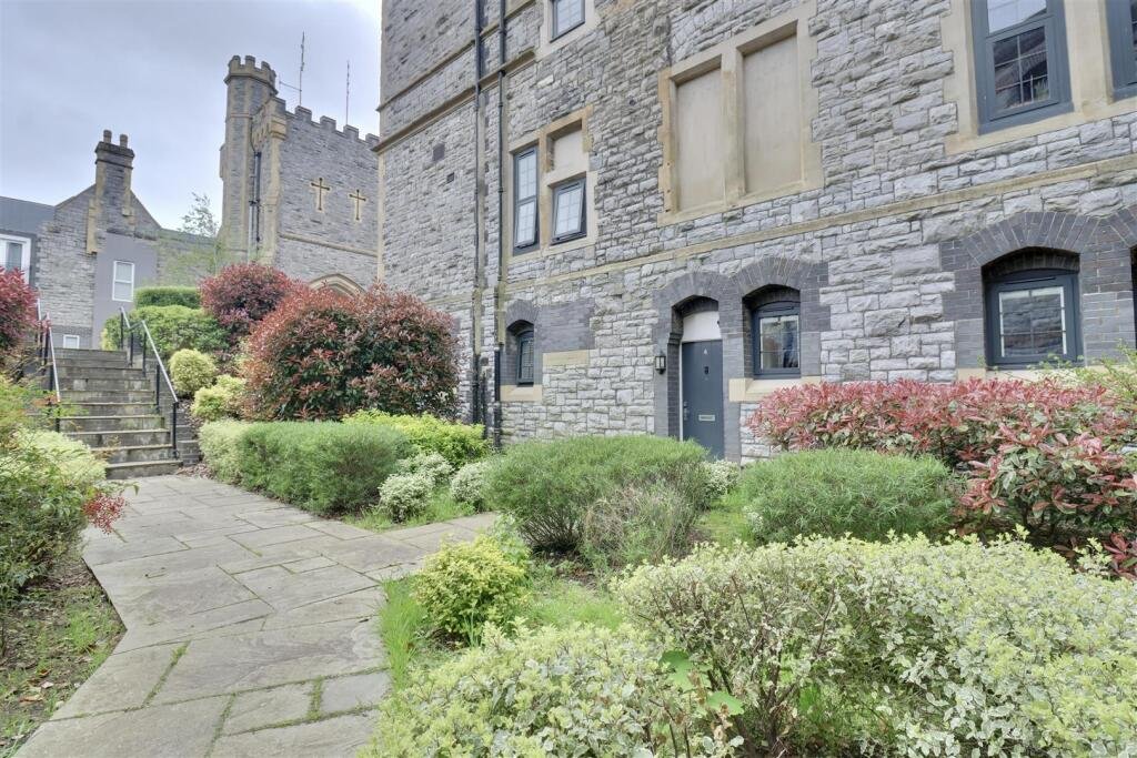 A luxury flat inside one of Britain's most notorious former prisons is on the market for £180,000 - the Victorian jail once housed serial killer Archibald Hall and EastEnders star Leslie Grantham.