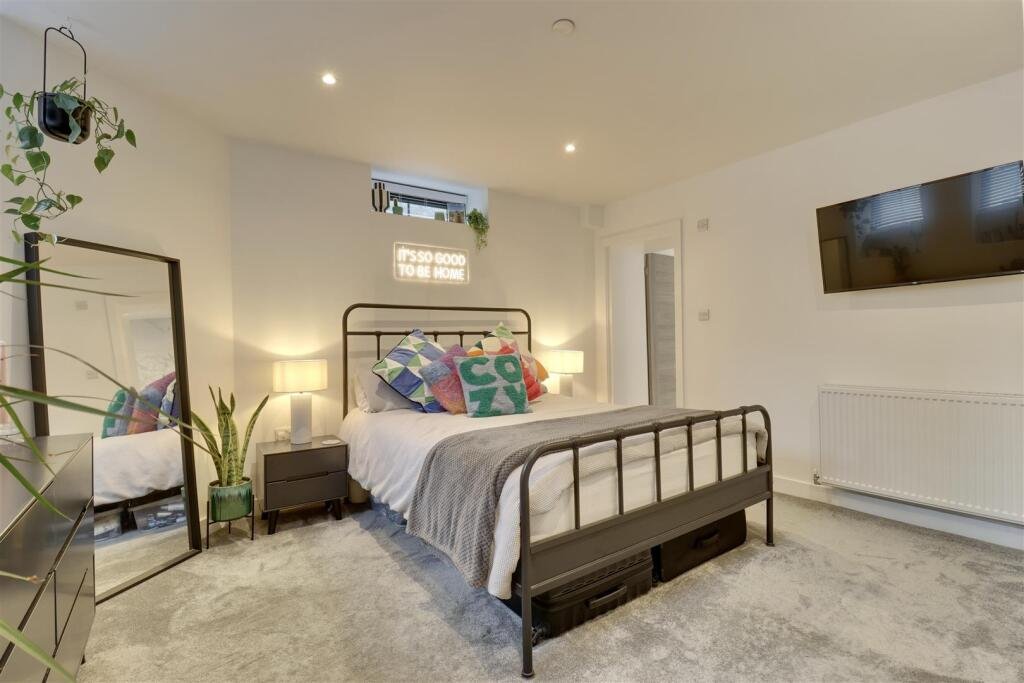 A luxury flat inside one of Britain's most notorious former prisons is on the market for £180,000 - the Victorian jail once housed serial killer Archibald Hall and EastEnders star Leslie Grantham.