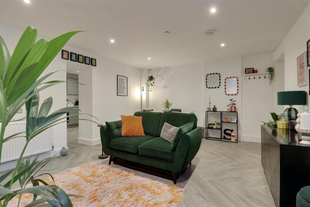 A luxury flat inside one of Britain's most notorious former prisons is on the market for £180,000 - the Victorian jail once housed serial killer Archibald Hall and EastEnders star Leslie Grantham.
