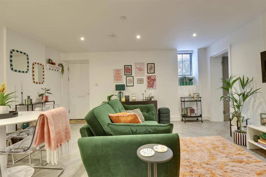 A luxury flat inside one of Britain's most notorious former prisons is on the market for £180,000 - the Victorian jail once housed serial killer Archibald Hall and EastEnders star Leslie Grantham.