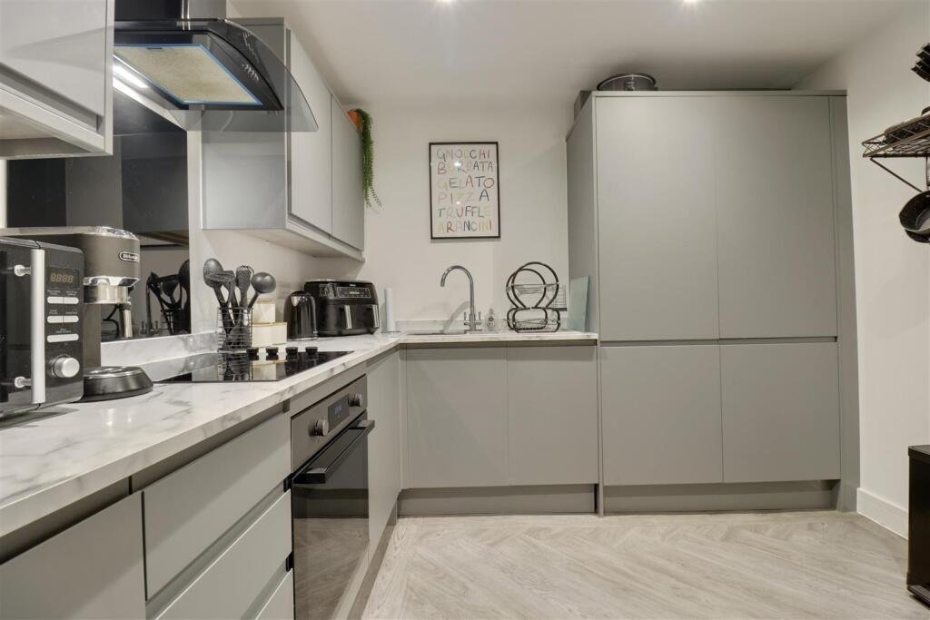 A luxury flat inside one of Britain's most notorious former prisons is on the market for £180,000 - the Victorian jail once housed serial killer Archibald Hall and EastEnders star Leslie Grantham.