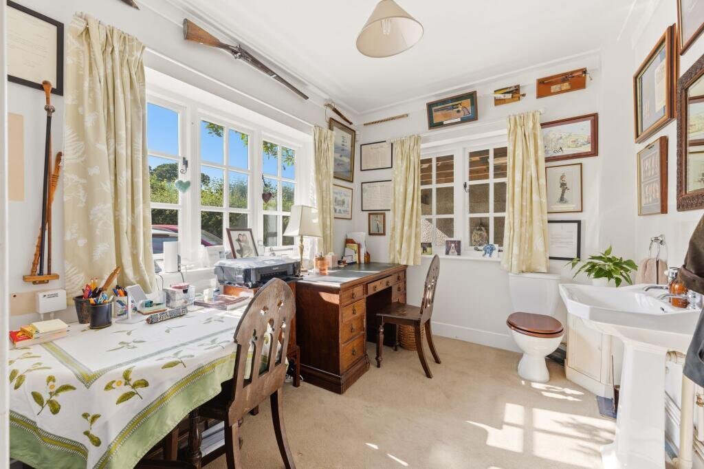 A £650,000 Somerset cottage is turning heads for all the wrong reasons - eagle-eyed house hunters spotted a fully functioning toilet sitting in the middle of the downstairs study.