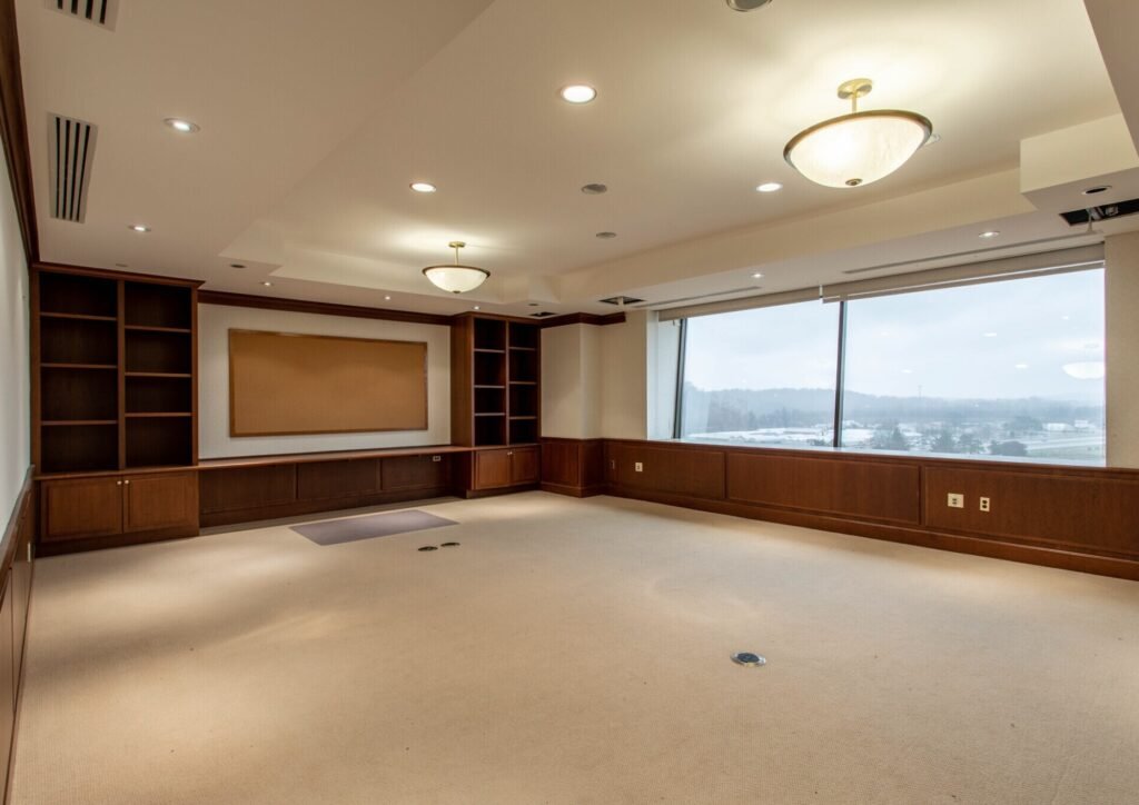 A seven-storey office building shaped like a giant picnic basket is back on the market for $8.5m - complete with 75-ton handles fitted with heating elements to stop ice building up.